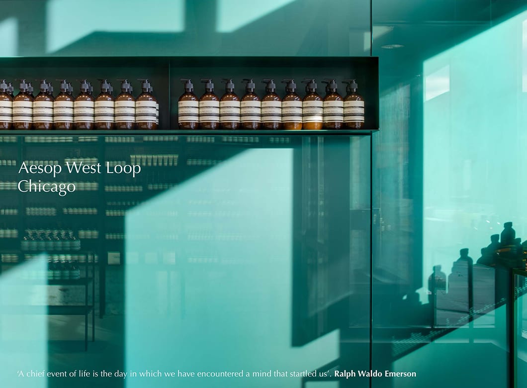 A detail view of Archetype Glass' custom laminated wall cladding in the Aesop West Loop retail space