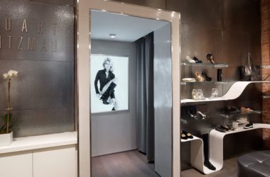 A wide view of the custom art glass wall cladding at Stuart Weitzman Soho, crafted by Archetype Glass