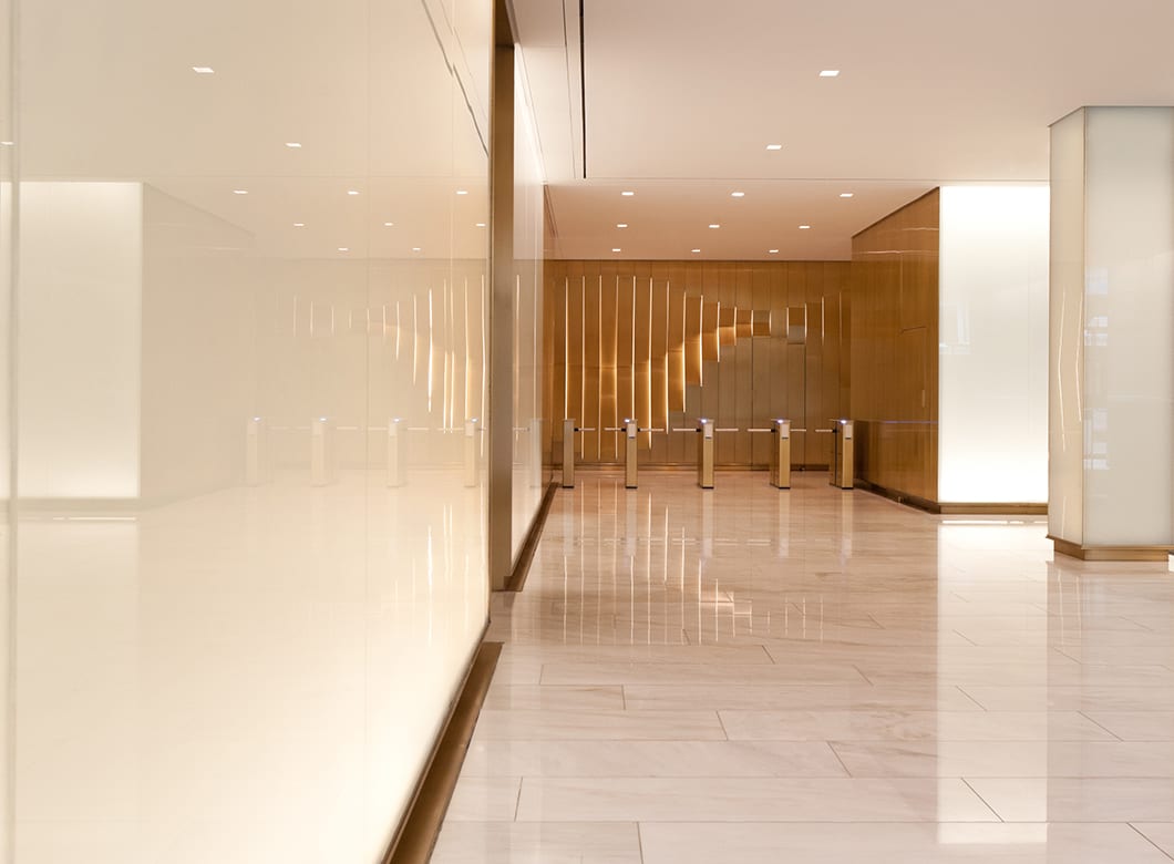 A detail view of the custom glass wall cladding at 3 Columbus Circle, crafted by Archetype Glass