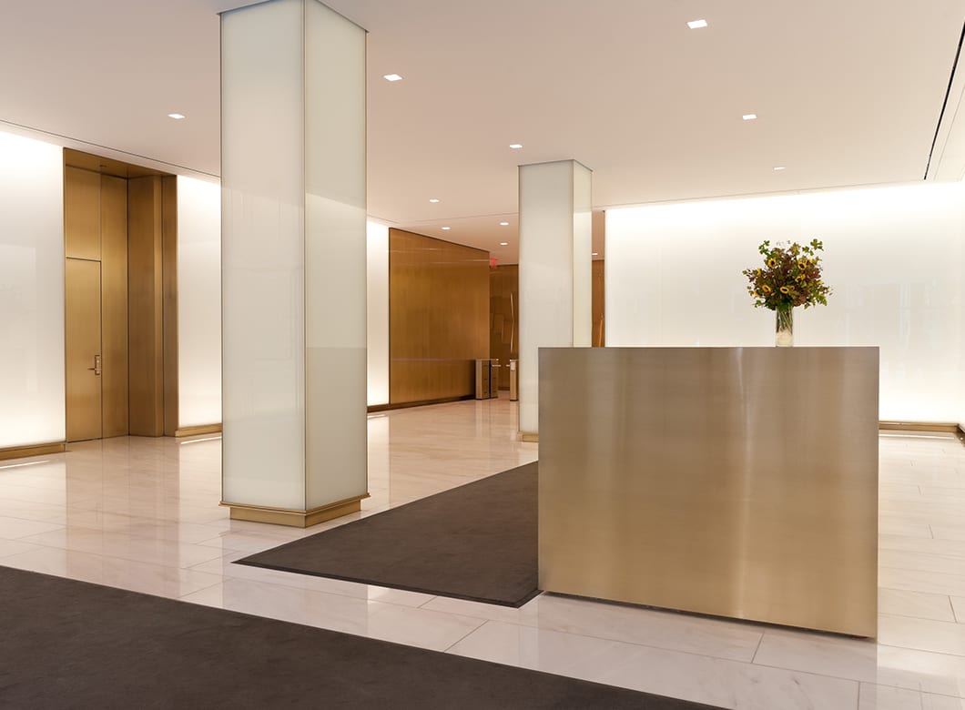 A wide view of the floor to ceiling custom glass wall cladding at 3 Columbus Circle