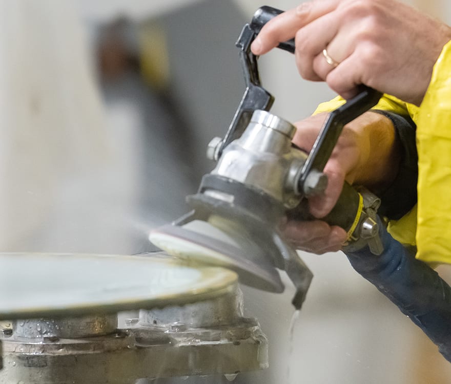 An Archetype Glass team member crafts custom laminated decorative glass