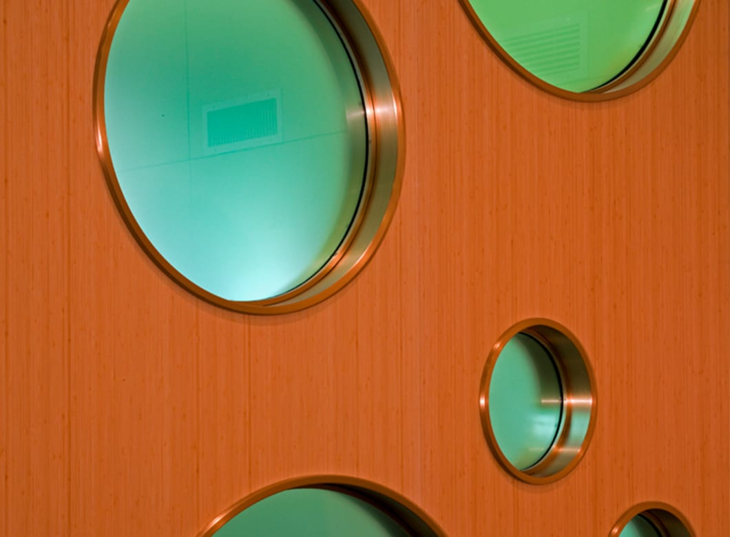 A detailed view of the custom laminated art glass inserts in the Mary Switzer Building, created by Archetype Glass