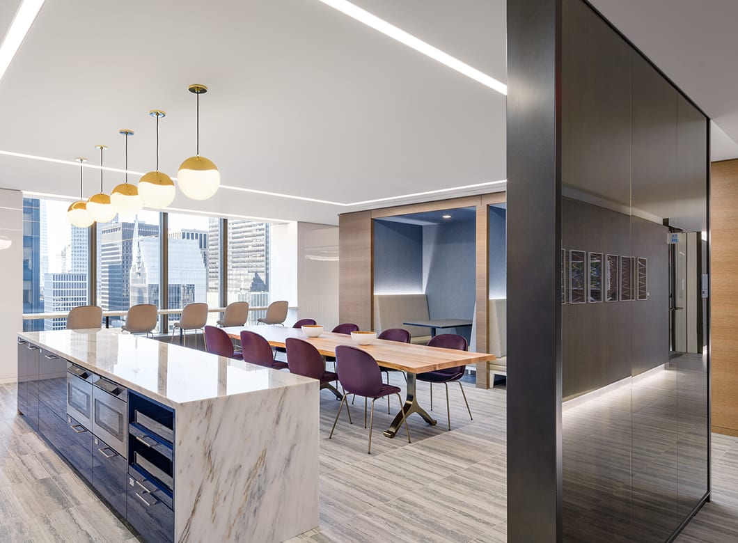 A view down the hallway of the Capital Group's office, with an oblique view of the custom laminated partition walls created by Archetype Glassw
