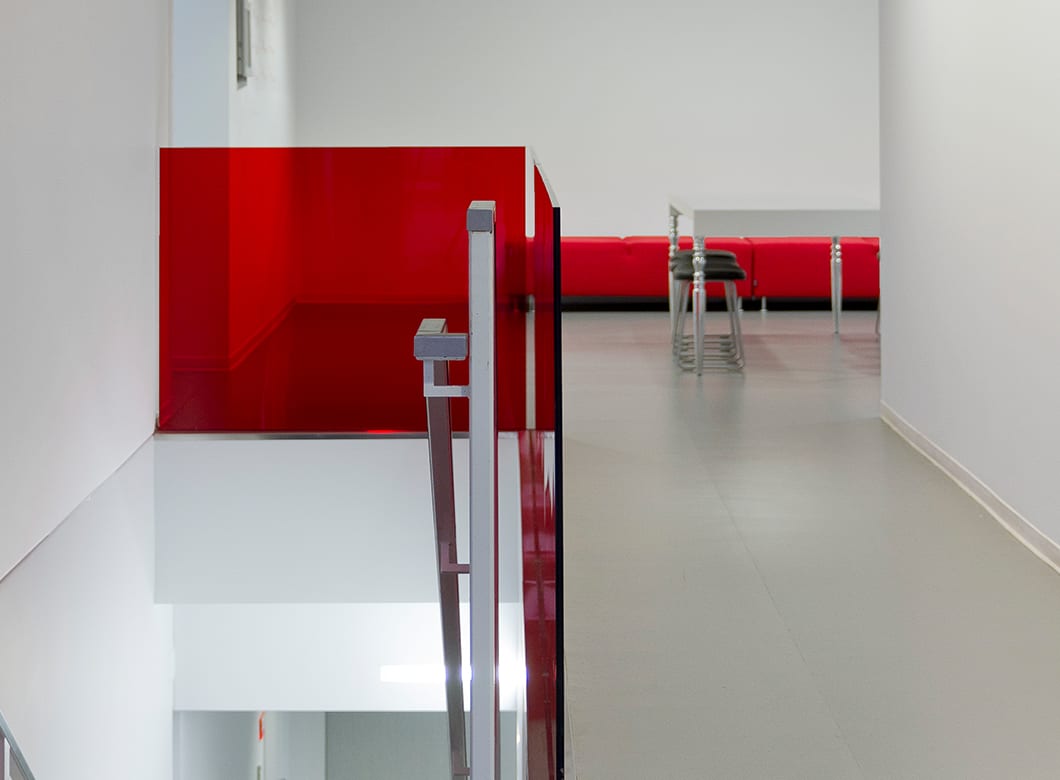 The custom laminated glass railings in the New York School of Interior Design, crafted by Archetype Glass