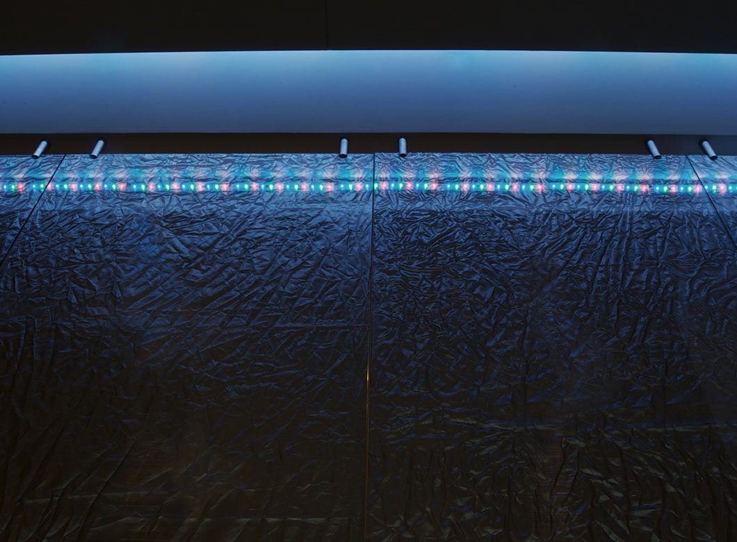 A detailed view of the LED lighting used in the Radcliffe Jewelers custom glass partition wall, crafted by Archetype Glass