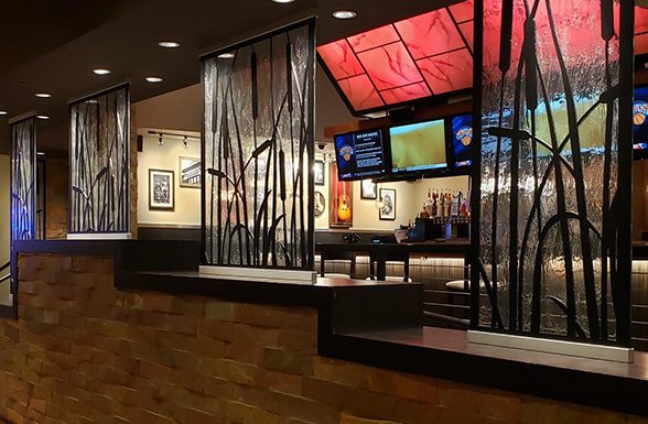 A wide view of Archetype Glass' custom textured glass partition walls at the Kankakee Grille
