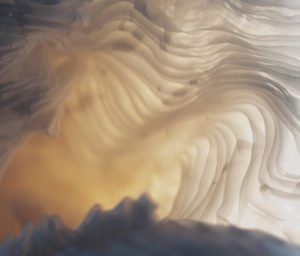 Close shot of a cream pleated fabric sample from Spatial Element, now in exclusive collaboration with Archetype Glass