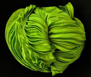 A green fabric sculpture from Spatial Element, now in exclusive collaboration with custom laminated glass manufacturer Archetype Glass