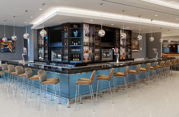 The Salt Lake City International Airport Delta Sky Lounge, featuring Archetype Glass' custom laminated fluted glass