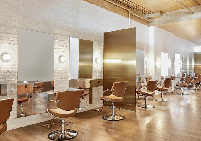 A wide shot of the Jenna Perry Hair Salon in New York, featuring our custom laminated tinted ribbed mirrored glass