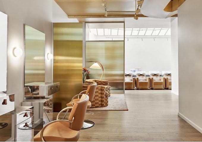 A view of the custom laminated glass divider created by Archetype Glass for the Jenna Perry Hair salon in New York